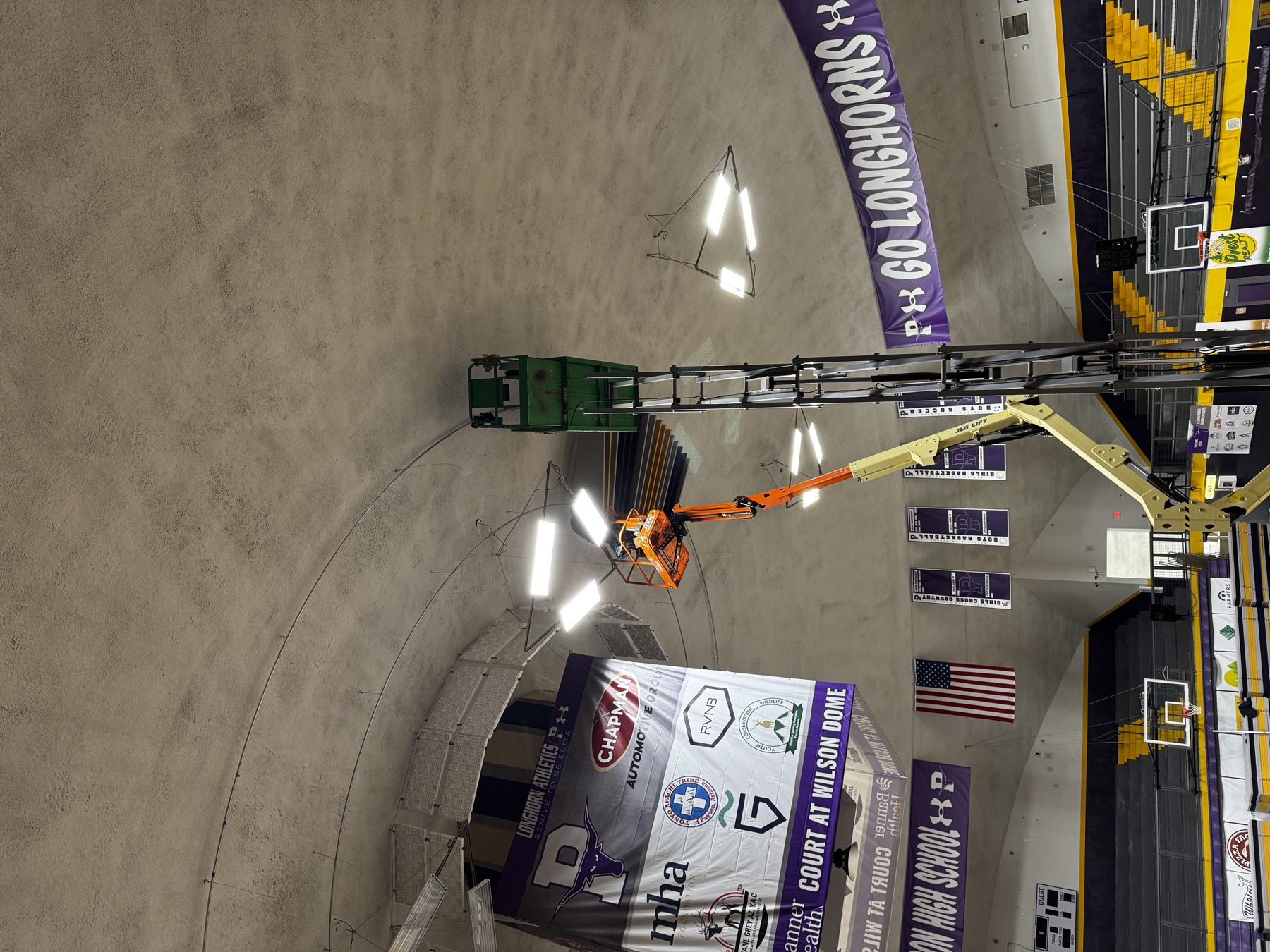 Measurement microphone on a stand on the gym floor during testing